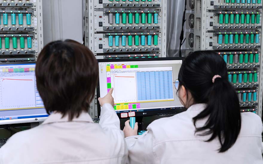 Employees checking R&D Lab Computers